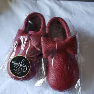 Monkey Feet Fringed bow moccs in cranberry